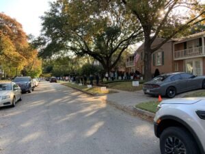 An image of a street lined with cars.